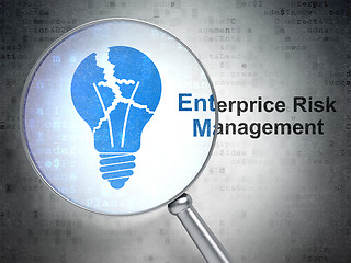 Image showing Finance concept: Light Bulb and Enterprice Risk Management with optical glass