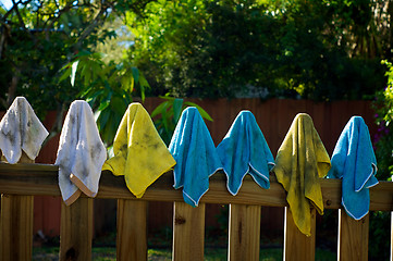 Image showing dirty rags hanging on fence