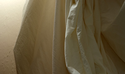 Image showing draped muslin background cloth with wall