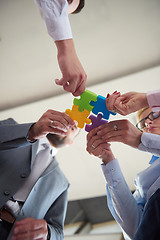 Image showing business people group assembling jigsaw puzzle