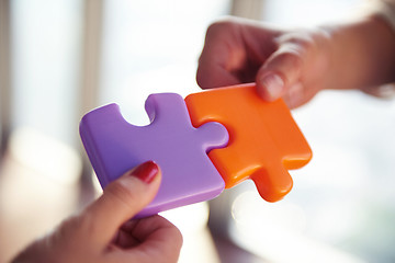 Image showing business people group assembling jigsaw puzzle