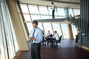 Image showing handosme business man working on tablet