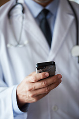 Image showing doctor speaking on cellphone