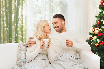 Image showing happy couple at home with christmas tree