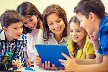 Image showing group of kids with teacher and tablet pc at school