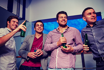 Image showing group of male friends with beer in nightclub