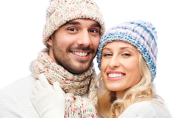 Image showing smiling couple in winter clothes hugging