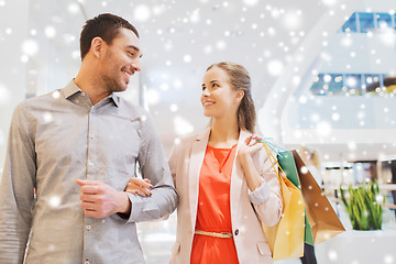 Image showing happy young couple with shopping bags in mall