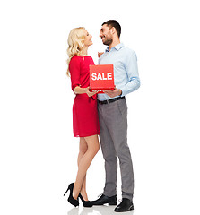 Image showing happy couple with red sale sign