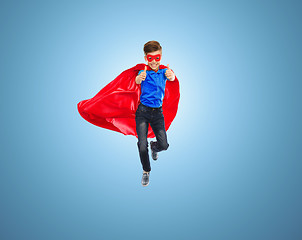 Image showing boy in super hero cape and mask showing thumbs up