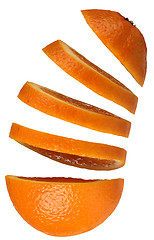 Image showing Orange with floating slices