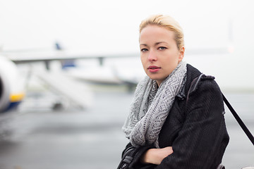 Image showing Woman boarding airplain.