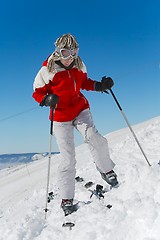 Image showing Putting on skis