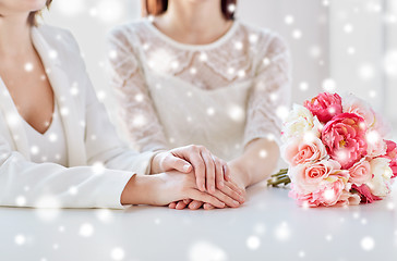 Image showing close up of happy lesbian couple with flowers