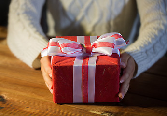 Image showing close up of woman with christmas gift