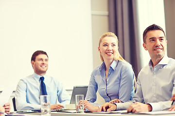 Image showing group of smiling businesspeople meeting in office