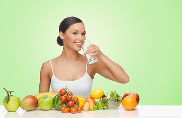 Image showing woman with fruits and vegetables drinking water