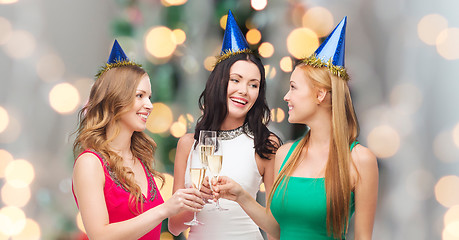 Image showing smiling women holding glasses of sparkling wine