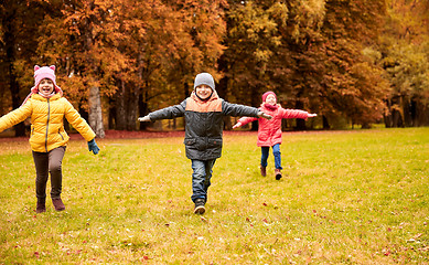 Image showing happy little children running and playing outdoors