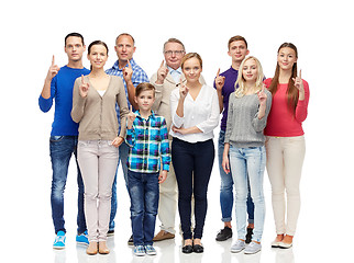 Image showing group of people pointing finger up