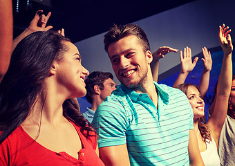 Image showing smiling friends at concert in club