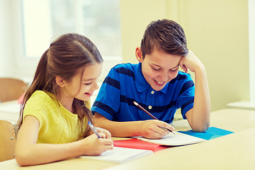 Image showing group of school kids writing test in classroom