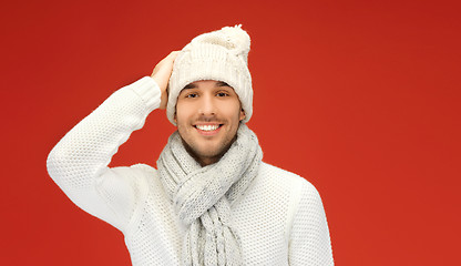 Image showing handsome man in warm sweater, hat and scarf