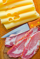 Image showing Bacon with cheese on the wooden board