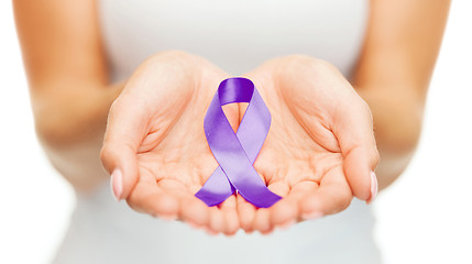 Image showing hands holding purple awareness ribbon