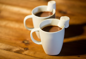 Image showing cups of hot chocolate with marshmallow on wood