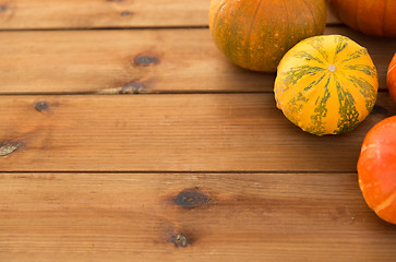 Image showing close up of pumpkins on wooden table at home