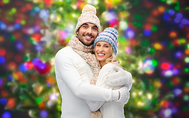 Image showing smiling couple in winter clothes hugging