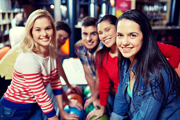 Image showing happy friends in bowling club