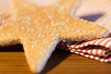 Image showing close up of star gingerbread cookie and towel