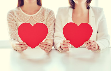 Image showing close up of happy lesbian couple with red hearts