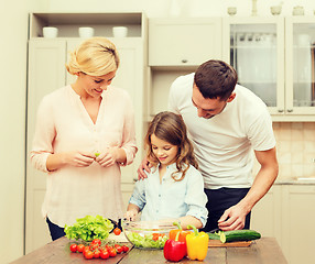 Image showing happy family making dinner in kitchen