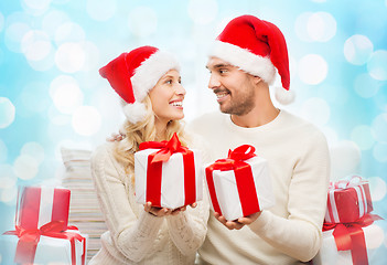 Image showing happy couple at home exchanging christmas gifts