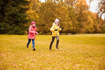 Image showing group of happy little girls running outdoors