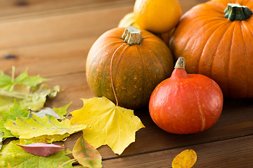 Image showing close up of pumpkins on wooden table at home