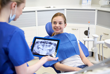 Image showing dentist with x-ray on tablet pc and patient girl