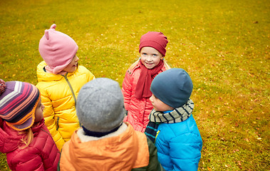 Image showing happy children standing in circle at autumn park