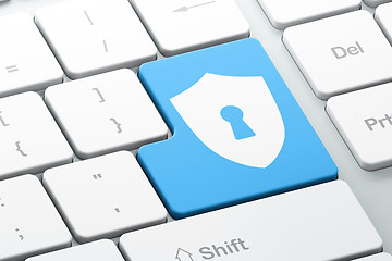 Image showing Privacy concept: Shield With Keyhole on computer keyboard background