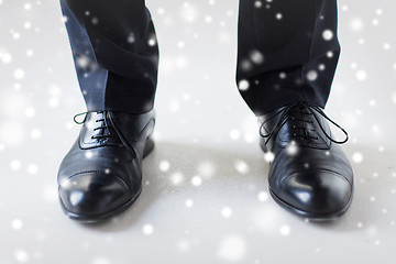 Image showing close up of man legs in elegant shoes with laces