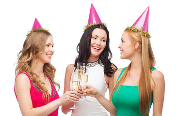 Image showing three women in pink hats with champagne glasses