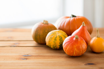 Image showing close up of pumpkins on wooden table at home