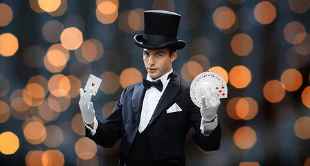 Image showing magician showing trick with playing cards