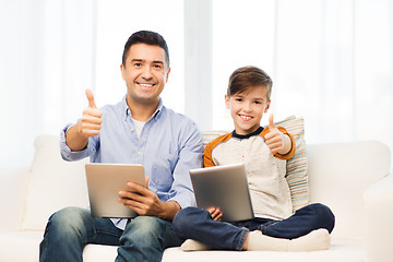 Image showing father and son with tablet pc showing thumbs up