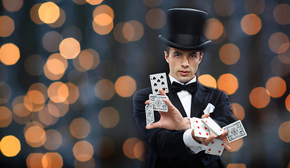 Image showing magician showing trick with playing cards