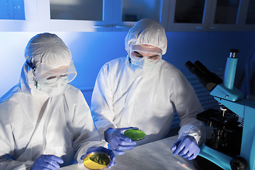 Image showing close up of scientists with test samples in lab