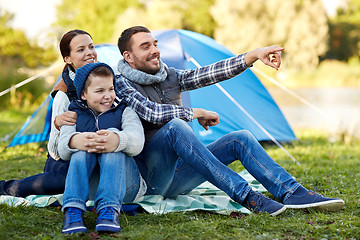 Image showing happy family with tent at camp site